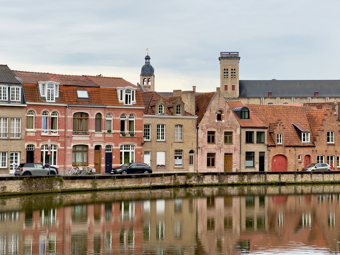 A row of buildings next to a body of water
